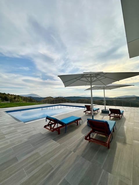 Patio, Day, Natural landscape, Pool view, Swimming pool, sunbed