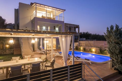 Property building, Patio, Night, Balcony/Terrace, Pool view, Swimming pool, sunbed