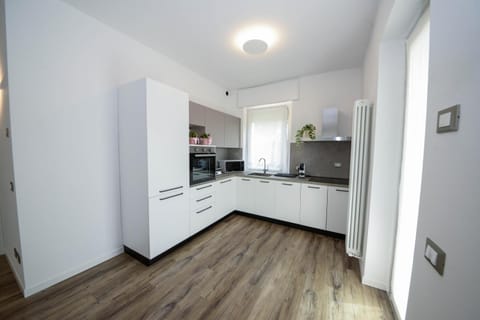 Kitchen or kitchenette, dishwasher, oven, stove