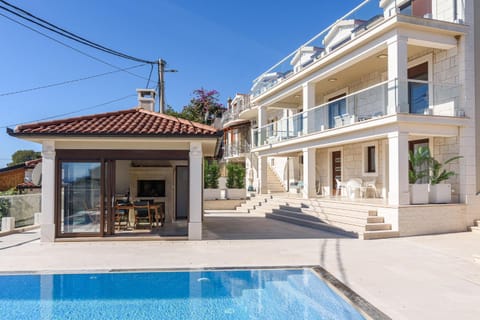 Property building, Patio, Day, Pool view, Swimming pool