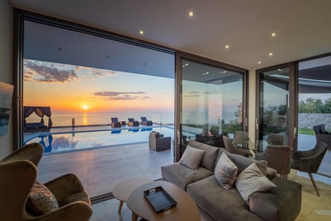 Living room, Seating area, Pool view, Sea view, Sunset