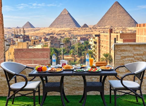 Property building, Patio, Nearby landmark, Day, Natural landscape, View (from property/room), Balcony/Terrace, Food and drinks, Dining area, Food, City view, Mountain view