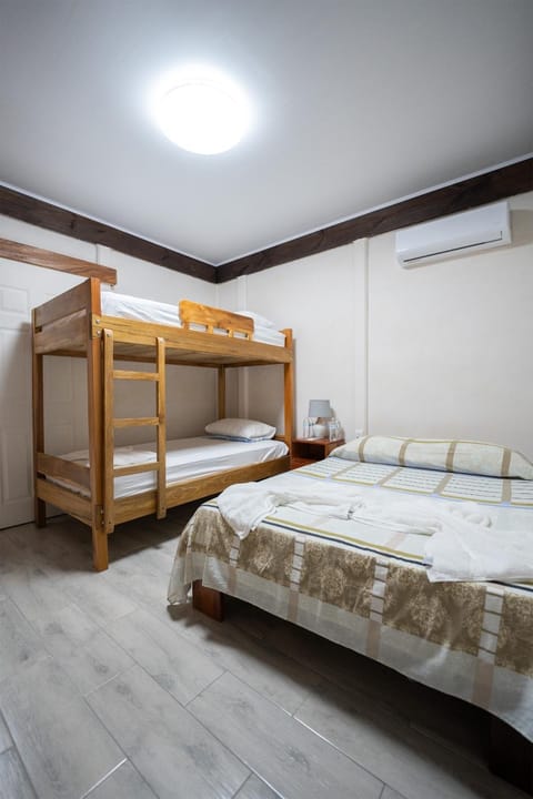 Bed, Photo of the whole room, Bedroom, bunk bed, towels, air conditioner
