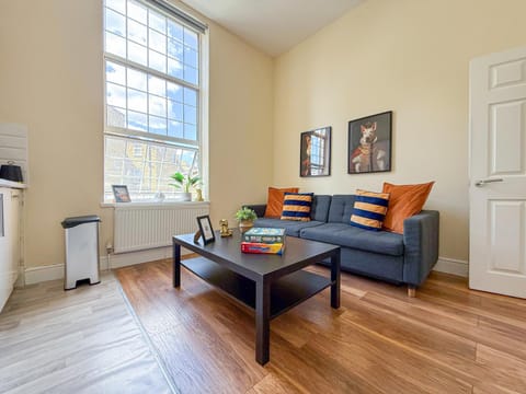 Property building, Day, TV and multimedia, View (from property/room), Kitchen or kitchenette, Living room, Decorative detail, Seating area, internet