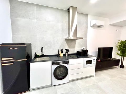 Kitchen or kitchenette, stove, air conditioner