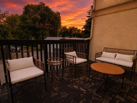 View (from property/room), Balcony/Terrace, Seating area, Sunset