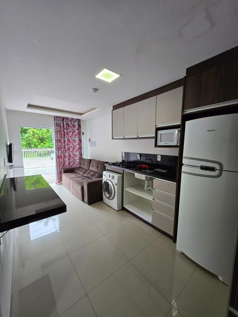 Kitchen or kitchenette, stove, washing machine, dryer