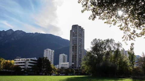 Property building, Nearby landmark, Day, Natural landscape, City view, Mountain view