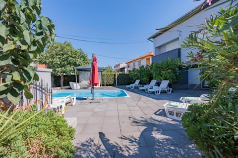 Property building, Patio, Day, Garden, Garden view, Pool view, Swimming pool, sunbed