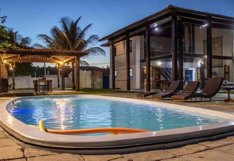 Property building, Patio, Natural landscape, Pool view, Swimming pool, sunbed