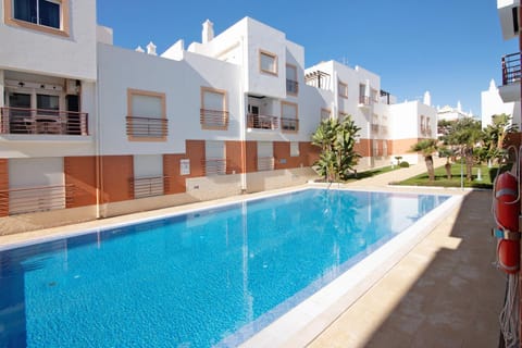 Property building, Living room, Swimming pool