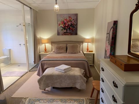 Bed, towels, wardrobe