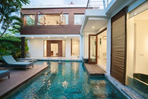 Property building, Patio, Pool view, Swimming pool, sunbed