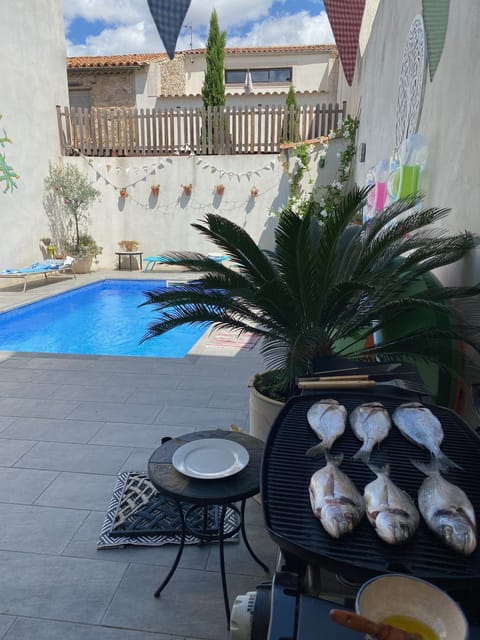Property building, Patio, BBQ facilities, Pool view, Swimming pool, sunbed