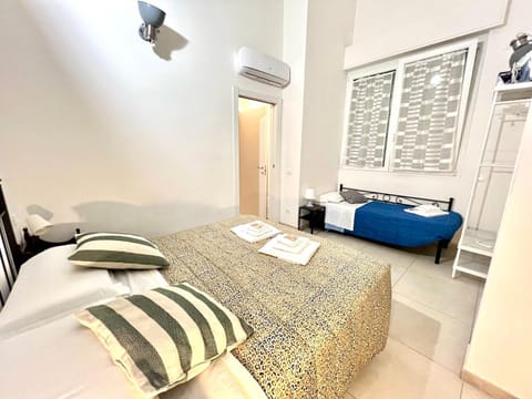 Bed, Photo of the whole room, Bedroom, towels, air conditioner