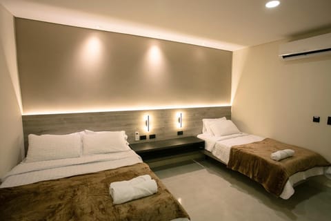 Bed, towels, air conditioner