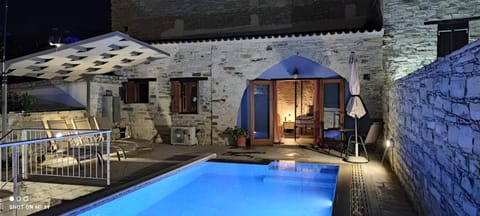 Property building, Patio, Night, Pool view, Swimming pool, sunbed