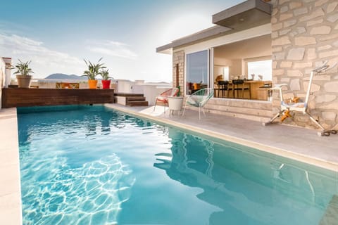 Property building, Living room, Swimming pool