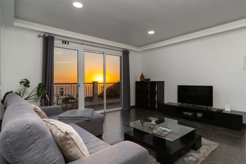 Property building, TV and multimedia, Living room, Seating area, Sunset