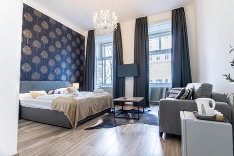 Bed, Living room, Seating area, Bedroom