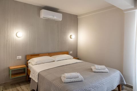 Bed, Photo of the whole room, Bedroom, towels, air conditioner