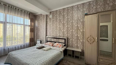 Bed, Bedroom, towels, wardrobe, air conditioner