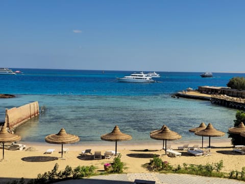 Property building, Nearby landmark, Day, Natural landscape, View (from property/room), View (from property/room), Beach, Garden view, Landmark view, Sea view, Sea view, sunbed