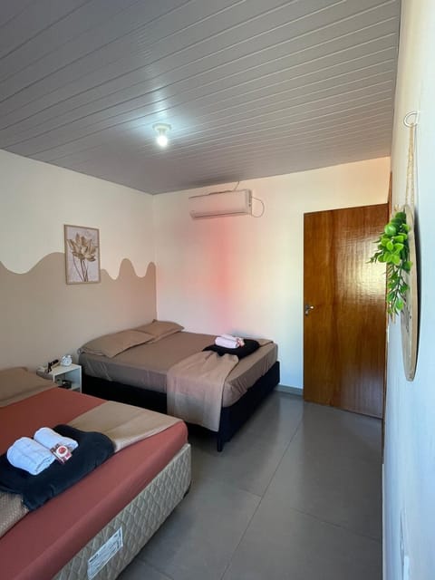 Bed, Photo of the whole room, Bedroom, towels, air conditioner