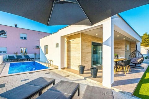 Property building, Patio, Day, View (from property/room), Balcony/Terrace, Seating area, Swimming pool, sunbed