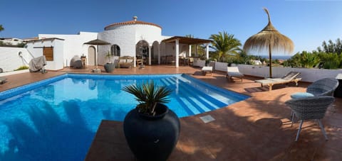 Property building, Patio, Natural landscape, Pool view, Swimming pool, sunbed