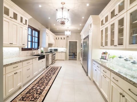 Kitchen or kitchenette, dishwasher, oven, stove
