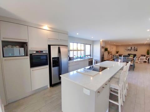 Kitchen or kitchenette, dishwasher, oven, stove