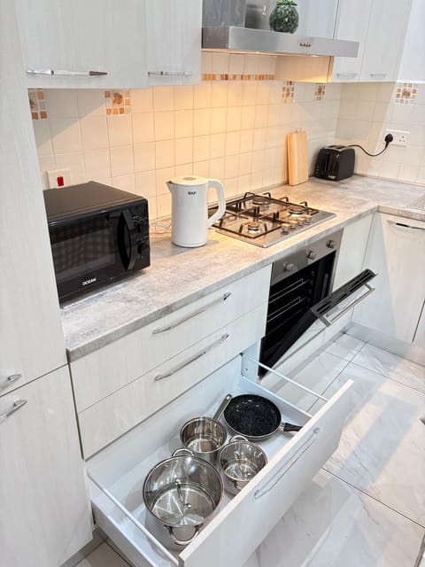 Kitchen or kitchenette, microwave, oven, stove, toaster