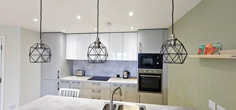 Kitchen or kitchenette, oven, stove, toaster