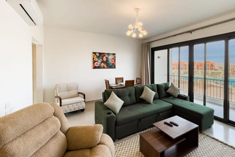 Balcony/Terrace, Living room, Seating area, Dining area, Pool view, furniture, air conditioner