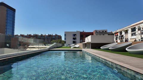 Property building, Day, Pool view, Swimming pool, sunbed