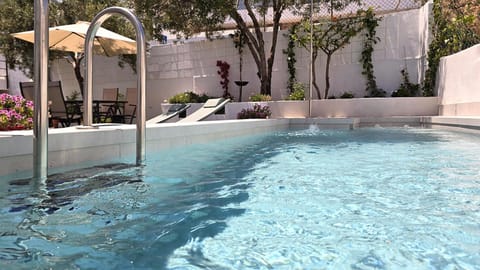 Swimming pool, sunbed