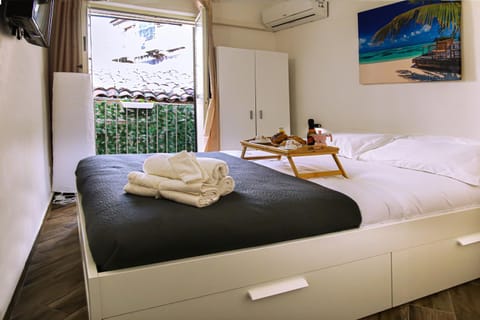 Bed, Photo of the whole room, Bedroom, towels, air conditioner