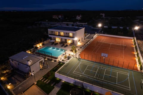 Property building, Night, Bird's eye view, Tennis court, Swimming pool