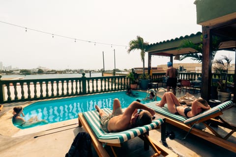 Patio, Day, People, View (from property/room), Balcony/Terrace, Pool view, Swimming pool, group of guests, sunbed