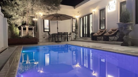 Patio, Night, Pool view, Swimming pool, sunbed
