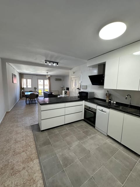 Kitchen or kitchenette, dishwasher, oven, stove