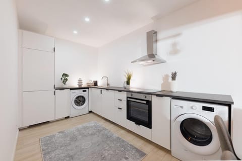 Kitchen or kitchenette, dishwasher, oven, stove, washing machine, dryer