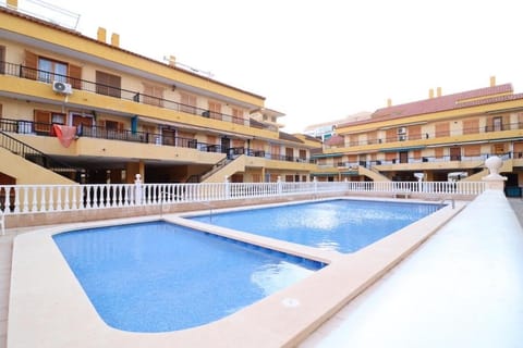 Property building, Day, Pool view, Swimming pool, sunbed