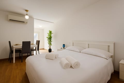 Bed, Photo of the whole room, Bedroom, towels, air conditioner