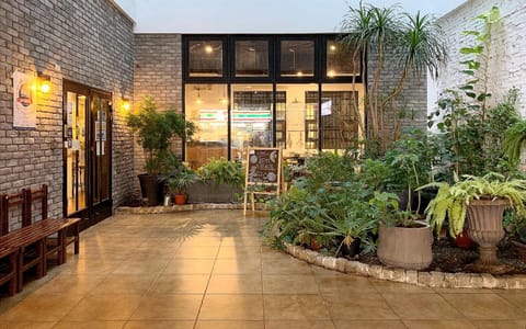 Property building, Patio, Communal lounge/ TV room, Facade/entrance, Day, Property logo or sign, Lounge or bar