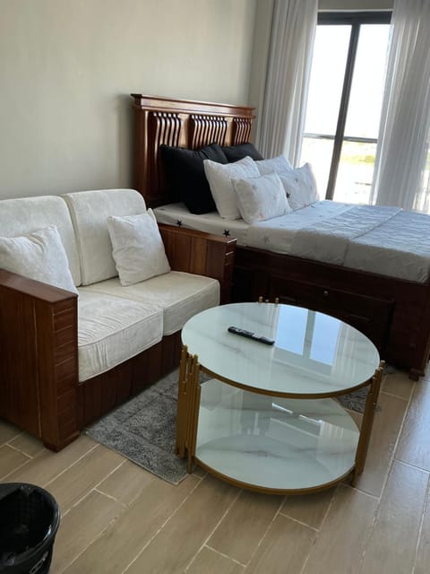 Bed, Living room, Seating area, Bedroom