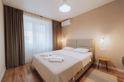 Bed, Photo of the whole room, Bedroom, towels, air conditioner