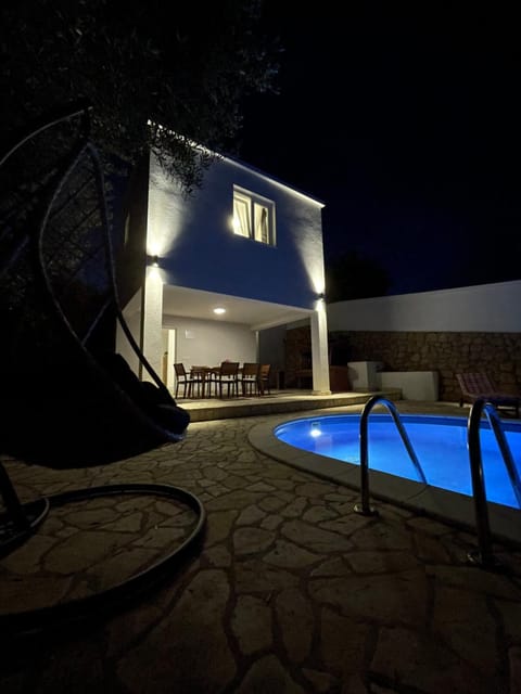 Property building, Patio, Night, Pool view, Swimming pool, sunbed
