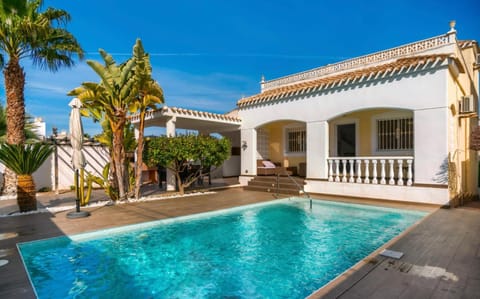 Property building, Patio, Pool view, Swimming pool, sunbed